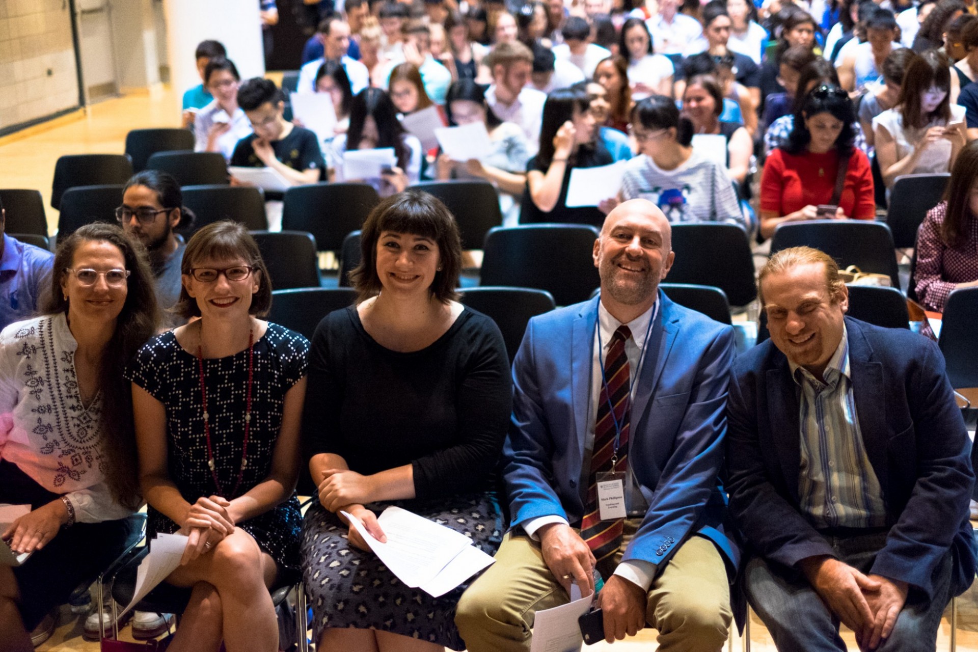 faculty in an auditorium